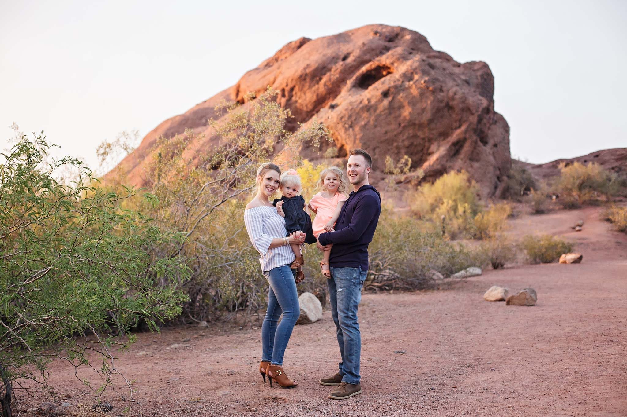 Family portrati in front of the hole in the rock at Papago park