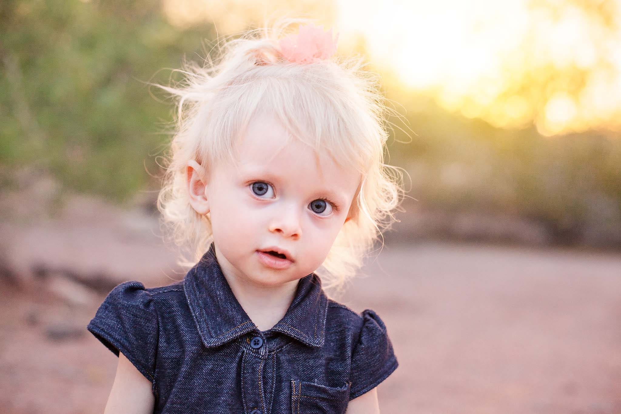 Two year old portrait outdoors at sunst
