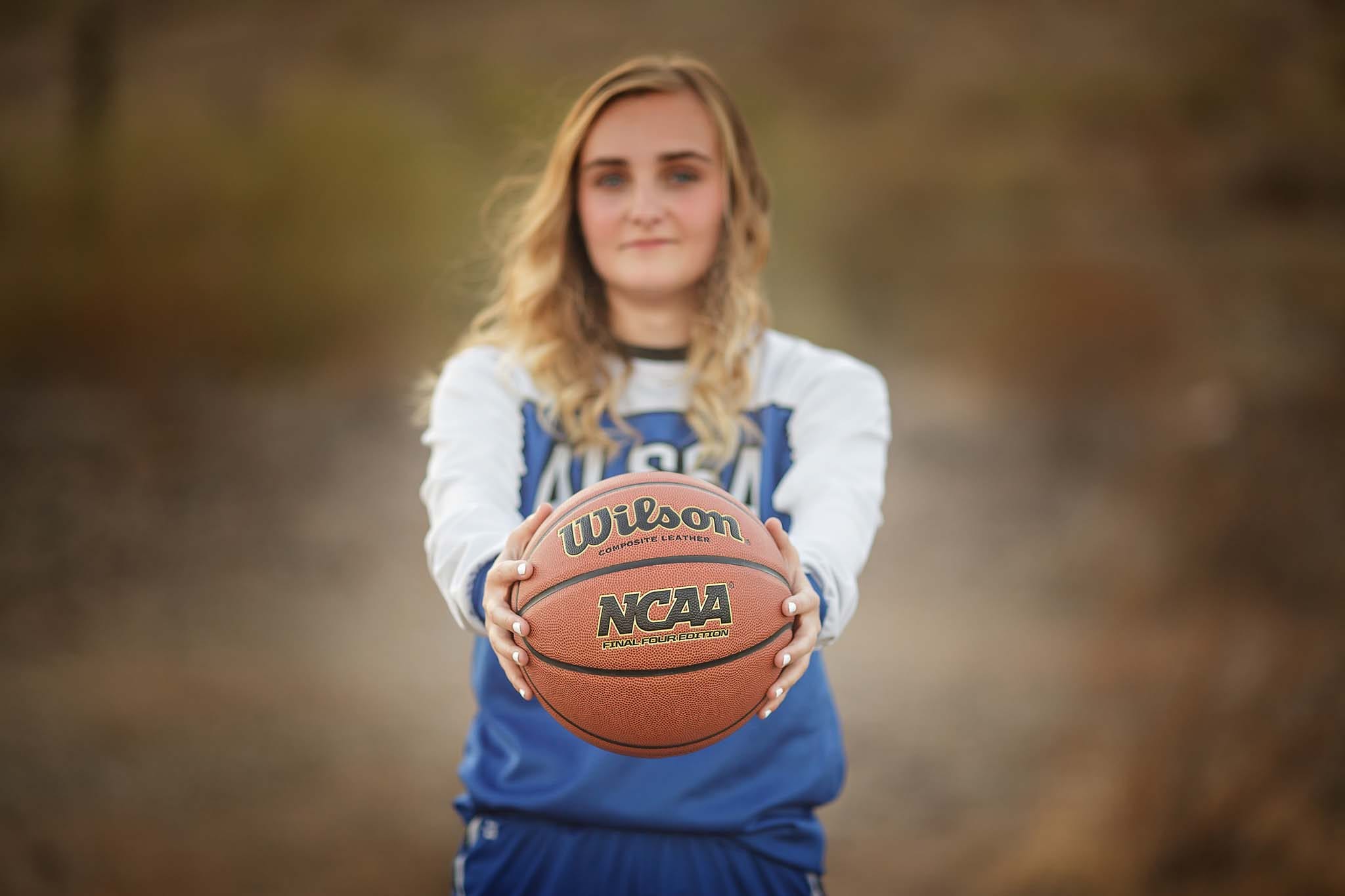 High School gril senior pictures with basketball