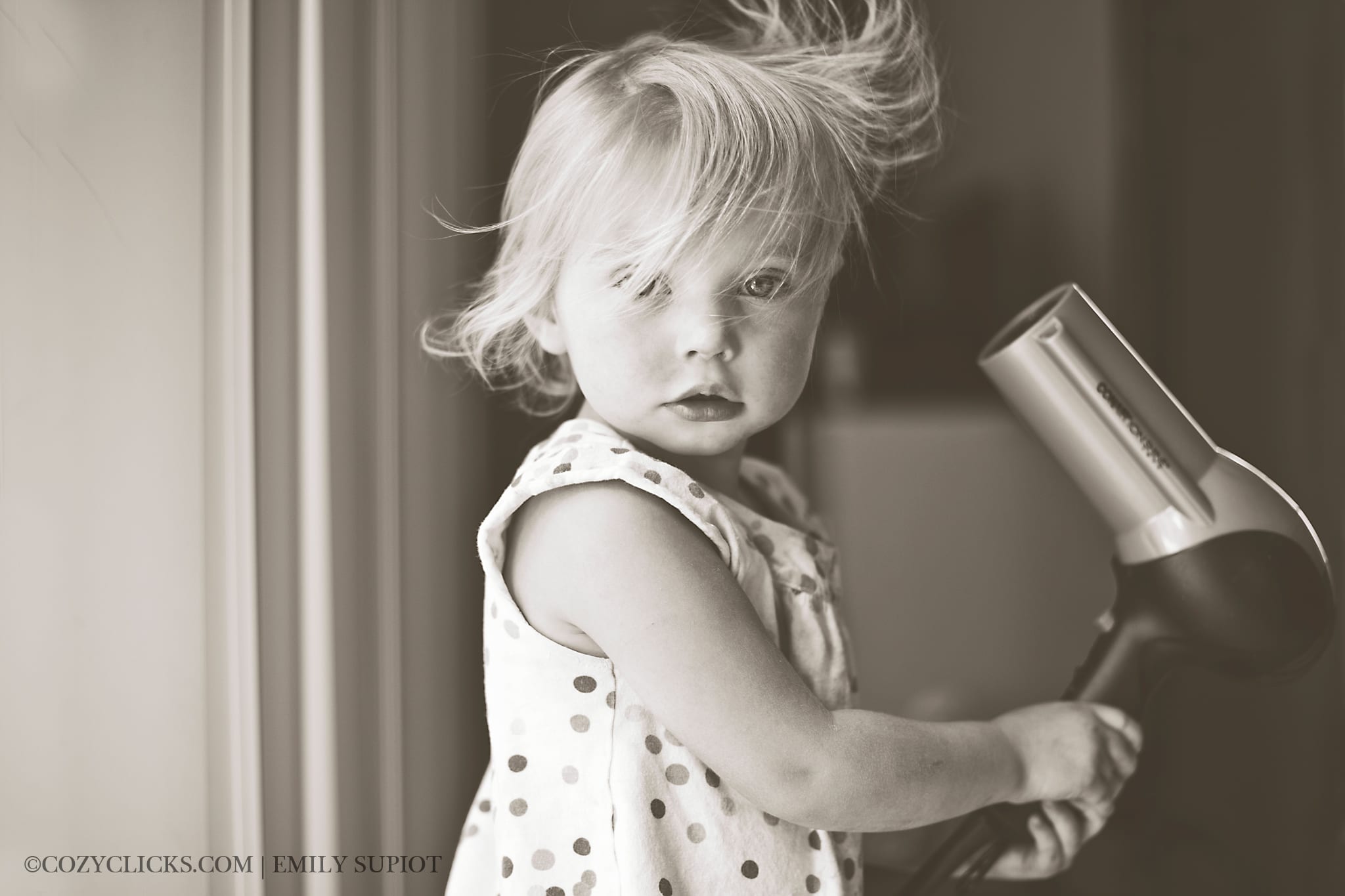 YMCA Ahwatukee Foothills featured artist of the month . Child photography black and white blow dryer photo