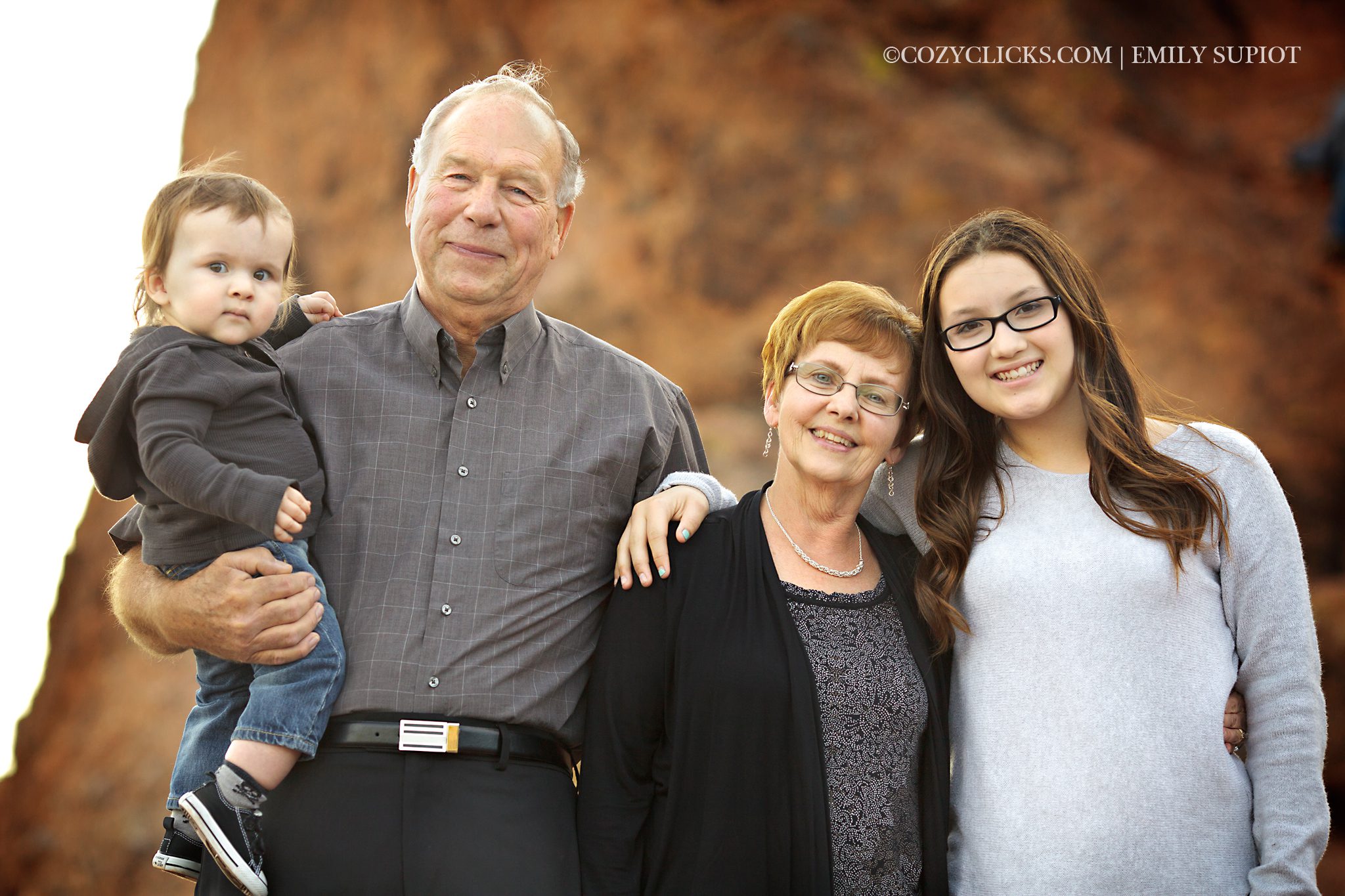 Photograph of grandparents and grand kids smiling together