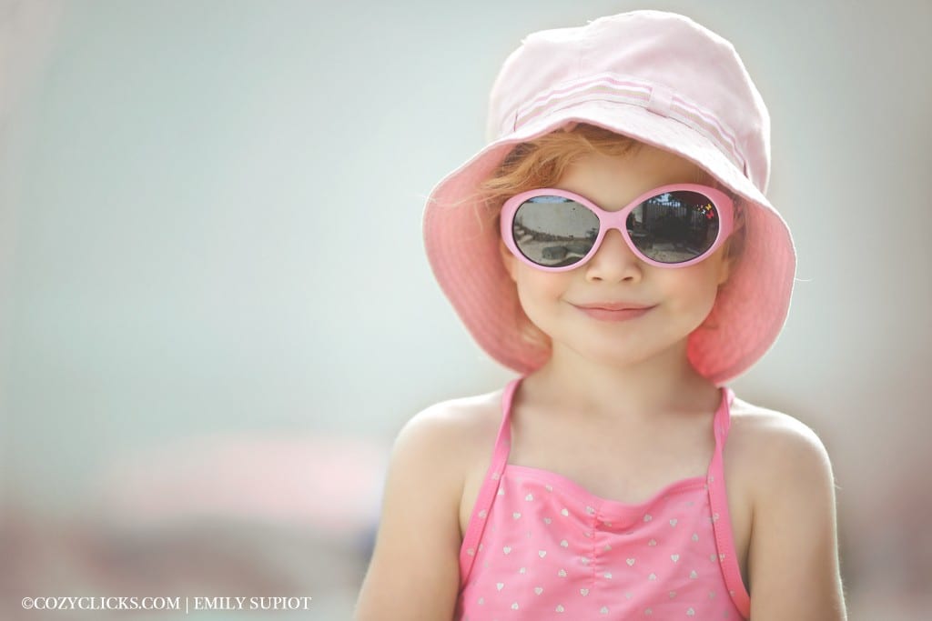 I heart faces challenge entry for hte April photo competion "pastel. Little girl in sunglasses at the pool