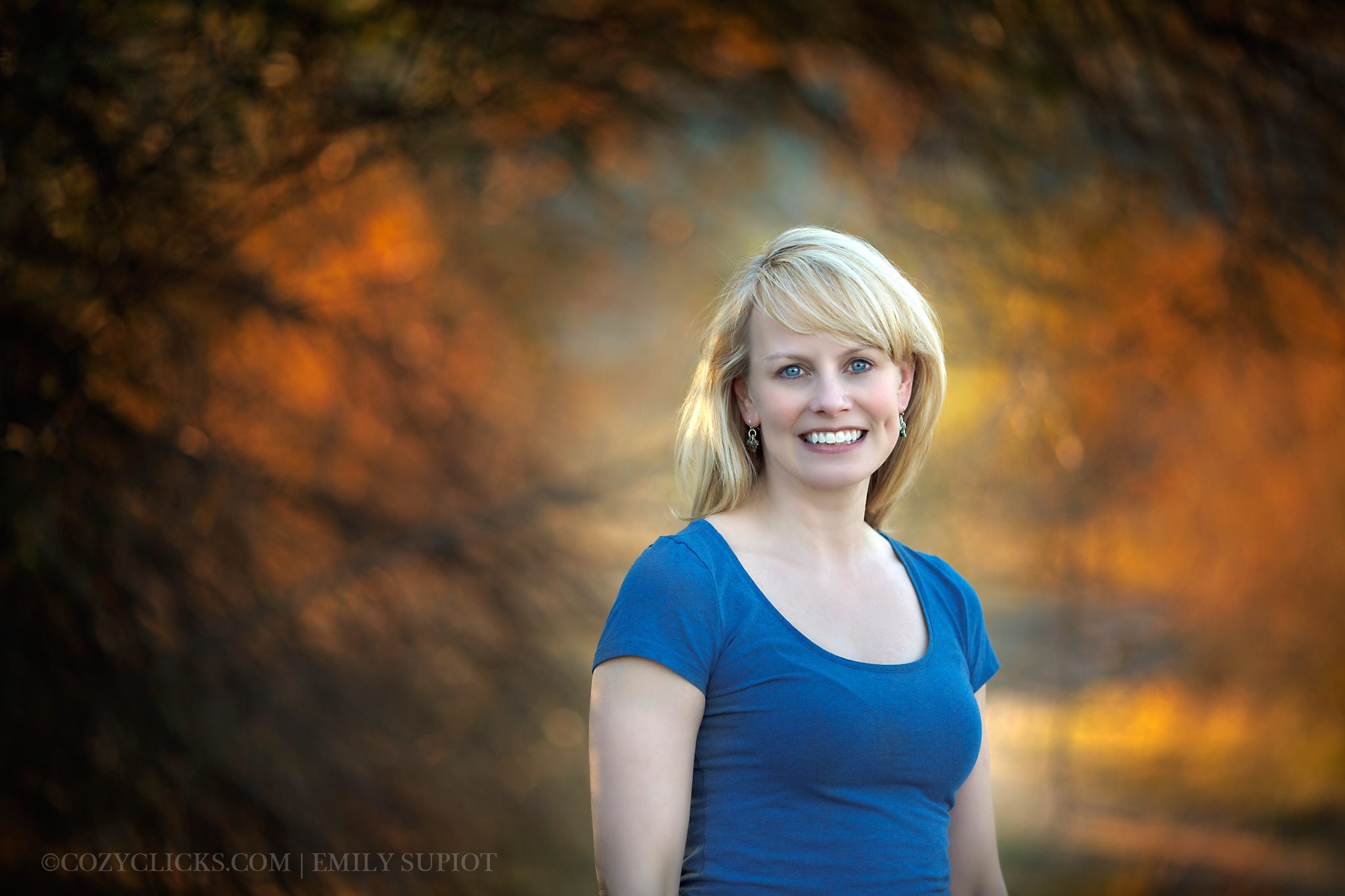 Gorgeous business portrait near a tree outdoors at sunset