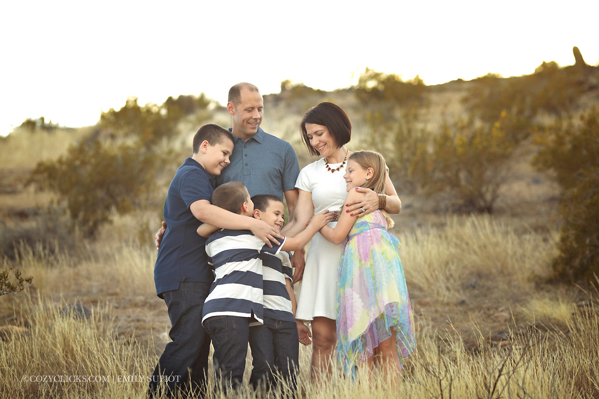 Fmaily hug photography on the mountain in Ahwatukee