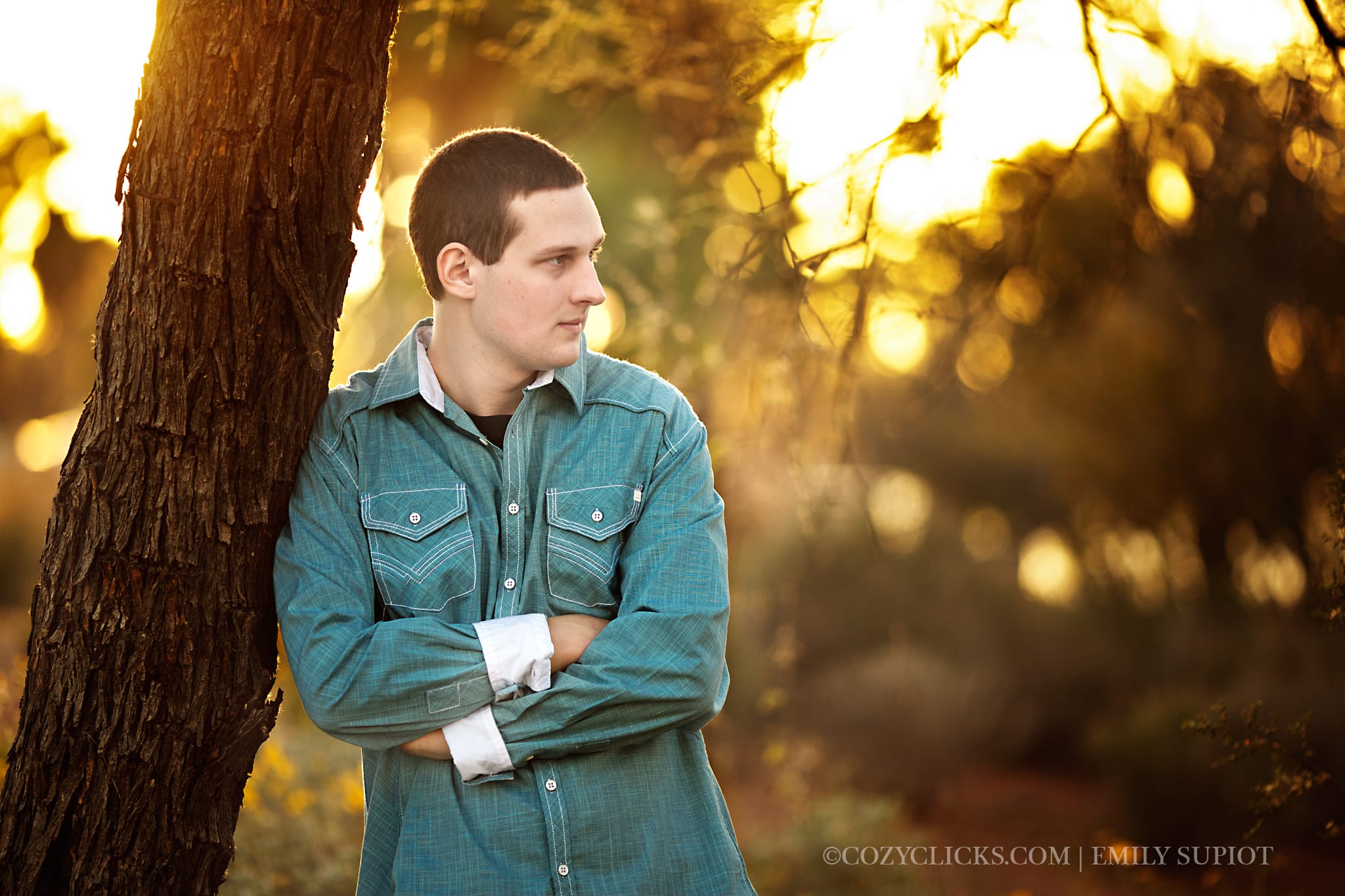 Male high school senior photograph with him looking away into the distance