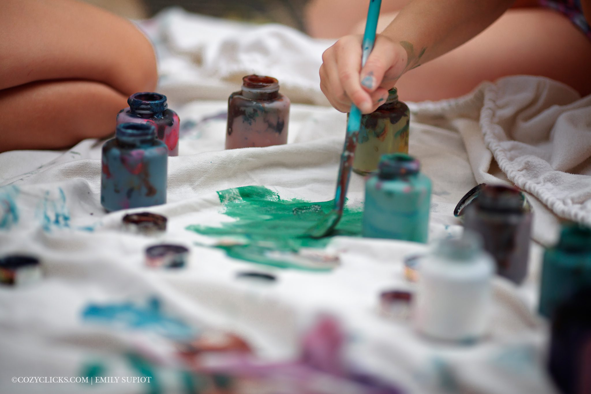 Little painters try not to get too messy in this photograph