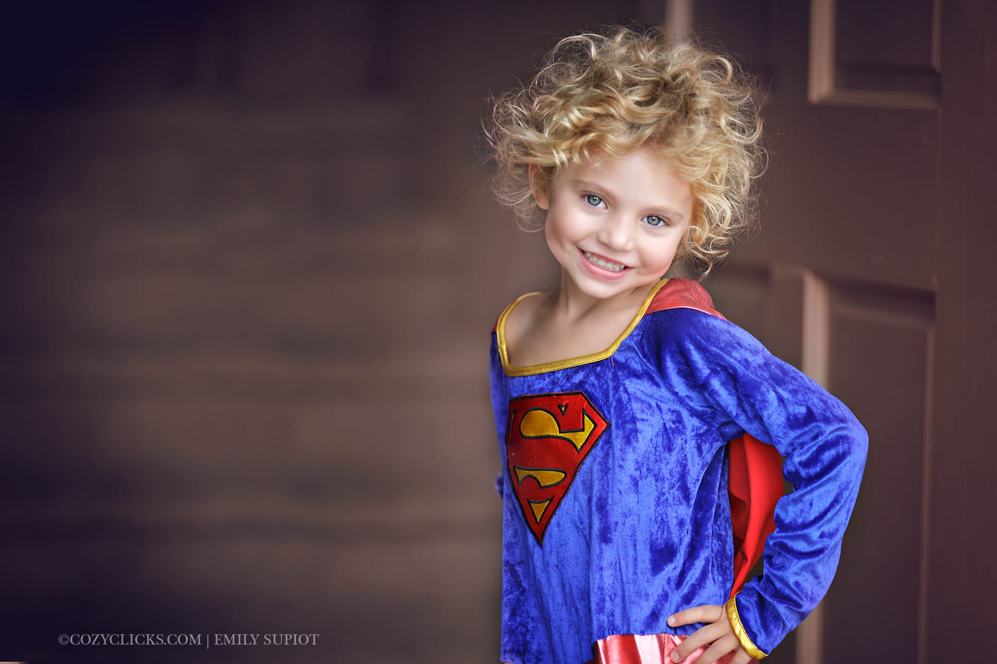 Phoneix children's Photographer captures little girl in a cute super girl costume.