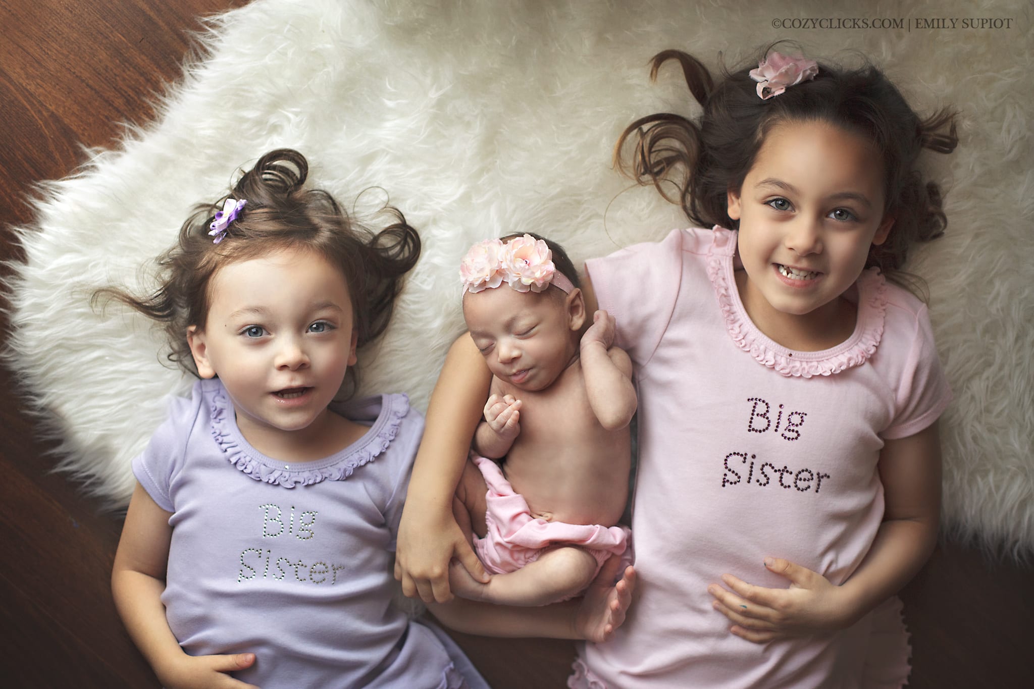 Newborn family photography sibling shot with three sisters