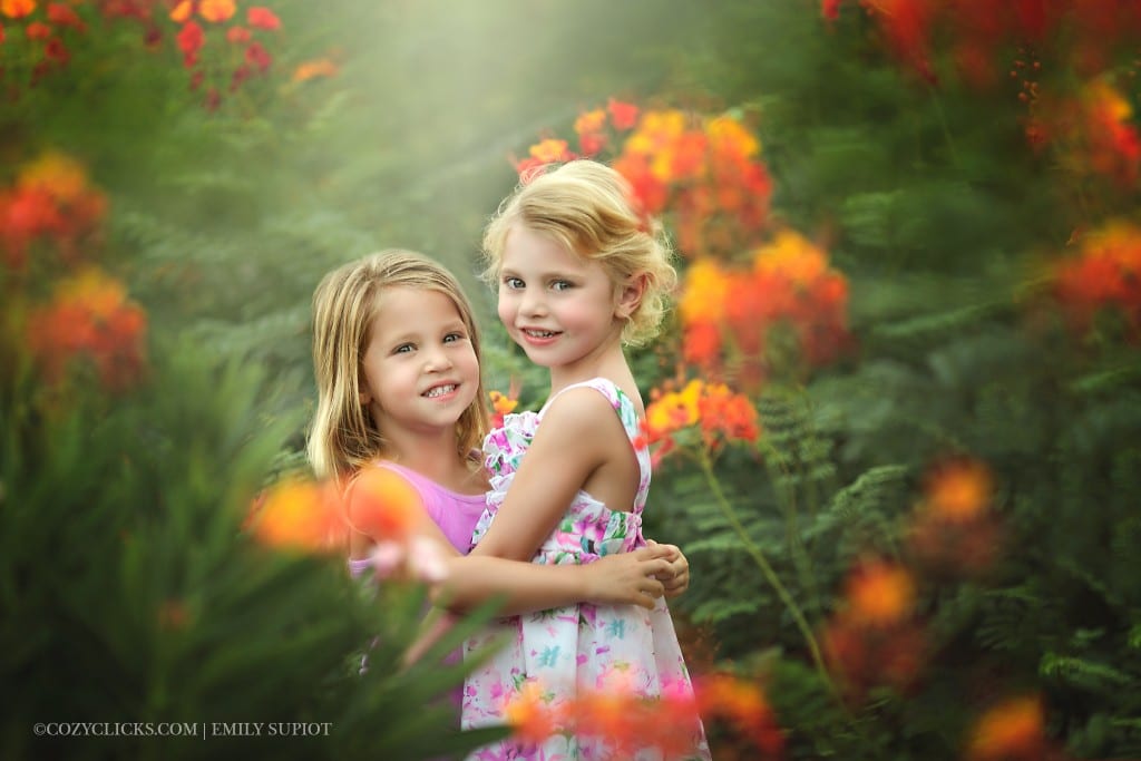 Two sisters smile for the camera in this Ahwatukee children's portrait