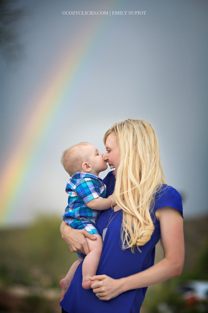 Mother and son together with rainbow in sky on a stormy evening in Ahwatukee