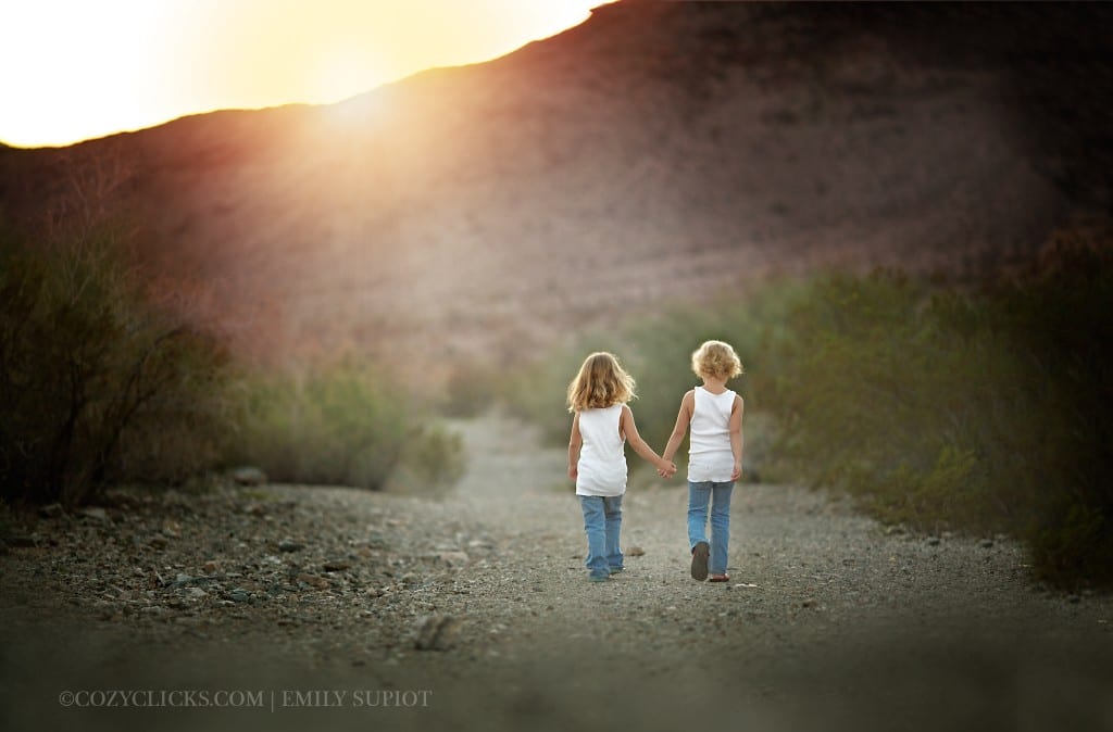Children holding hands and walking up a mountain path in Phoenix 85048 85044