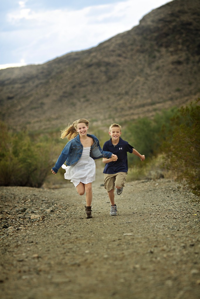 Sibling splaying on South Mountain in Ahwatukee in this fun sibling photography session