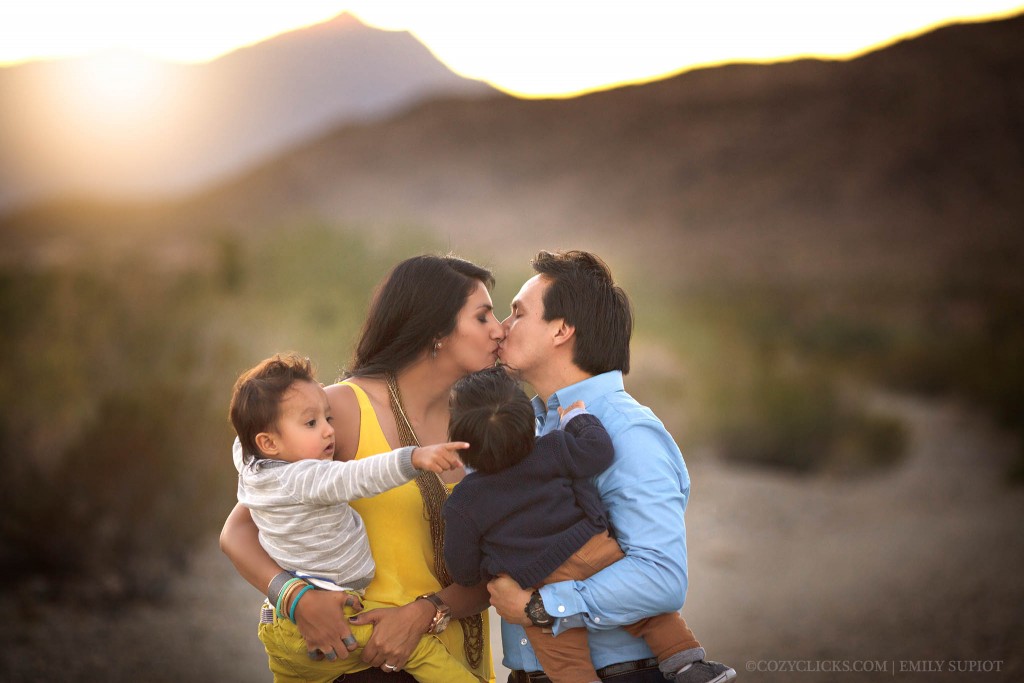 Fmaily with two toddlers kiss in this beautiful Phoenix family portrait