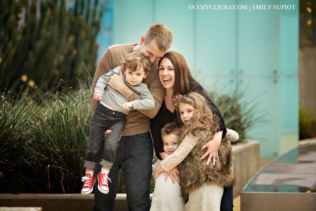 Fun family of five portrait taken in Mesa with contemporary backdrop