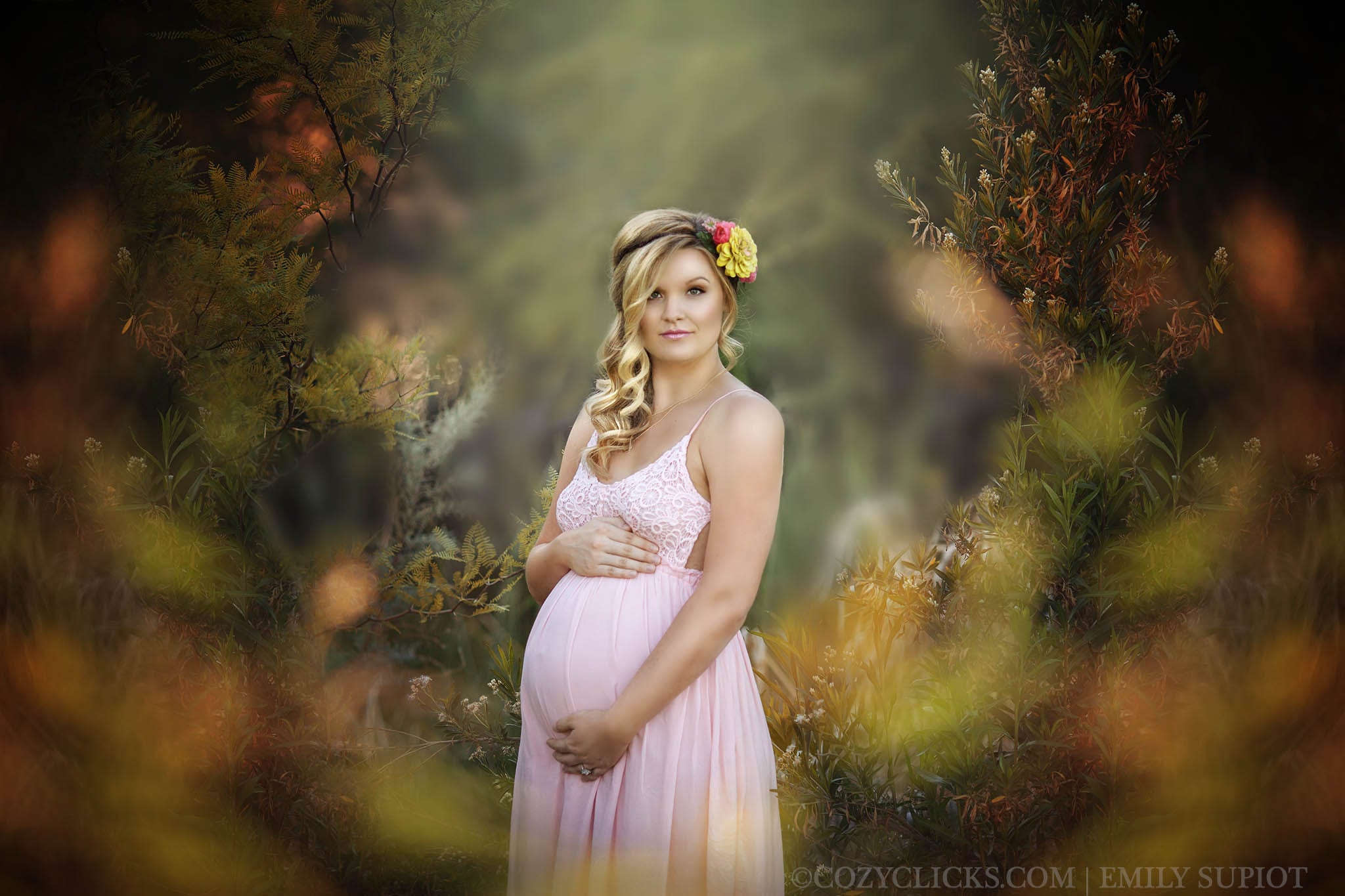 One of the most beautiful maternity photos taken in Phoenix, Arizona. Maternity picture taken near Scottsdale in grassy flowery area.