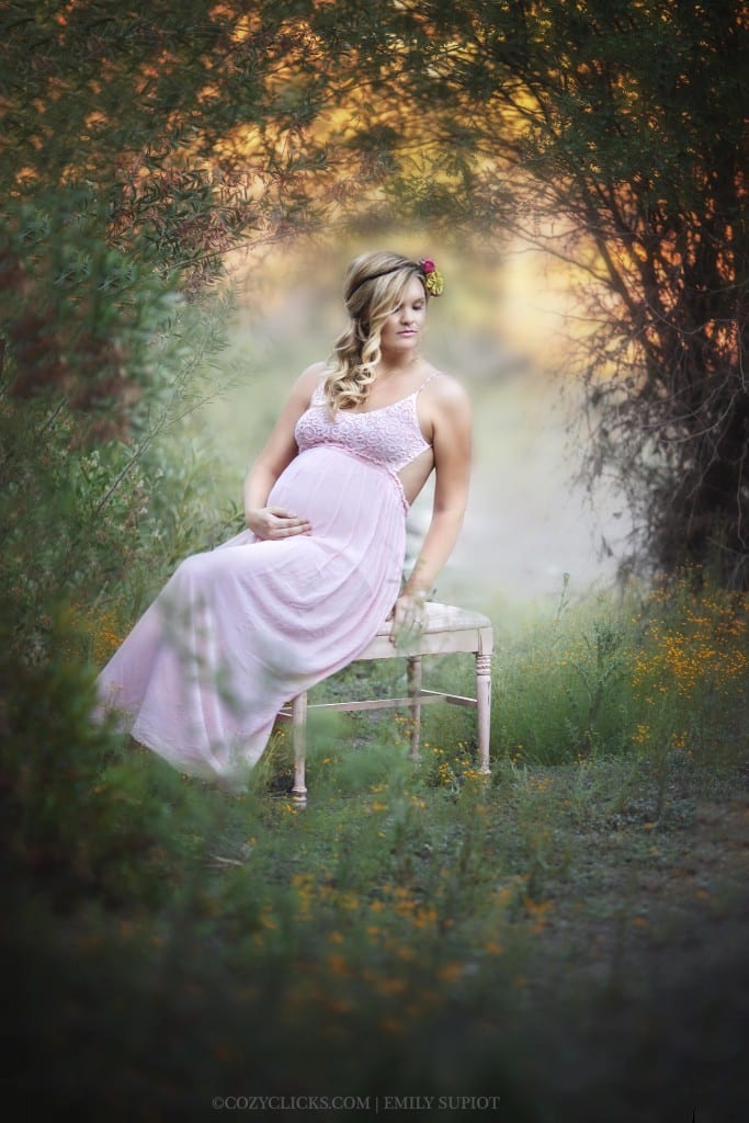 Pregnancy photo of mom to be sitting peacefully in Phoneix, Arizona wearing maternity gown and flower crown