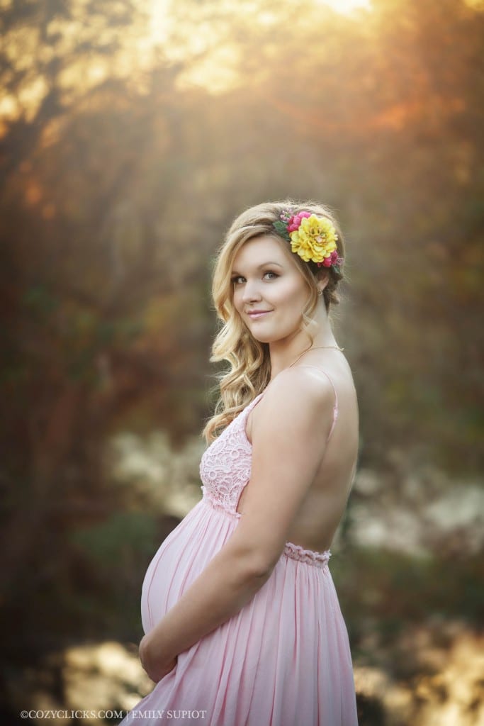 Pretty mom to be in maternity side portrait with flower crown taken in Arizona 85048 85044