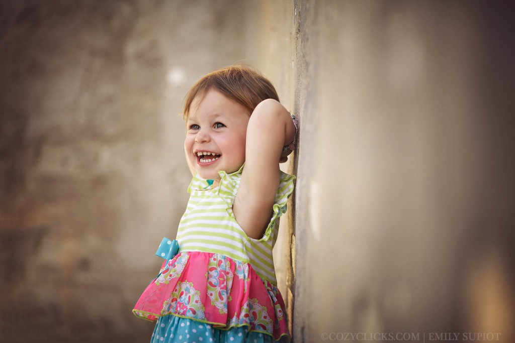 Toddler laughing during her portrait at Scorpion Gulch in Phoenix