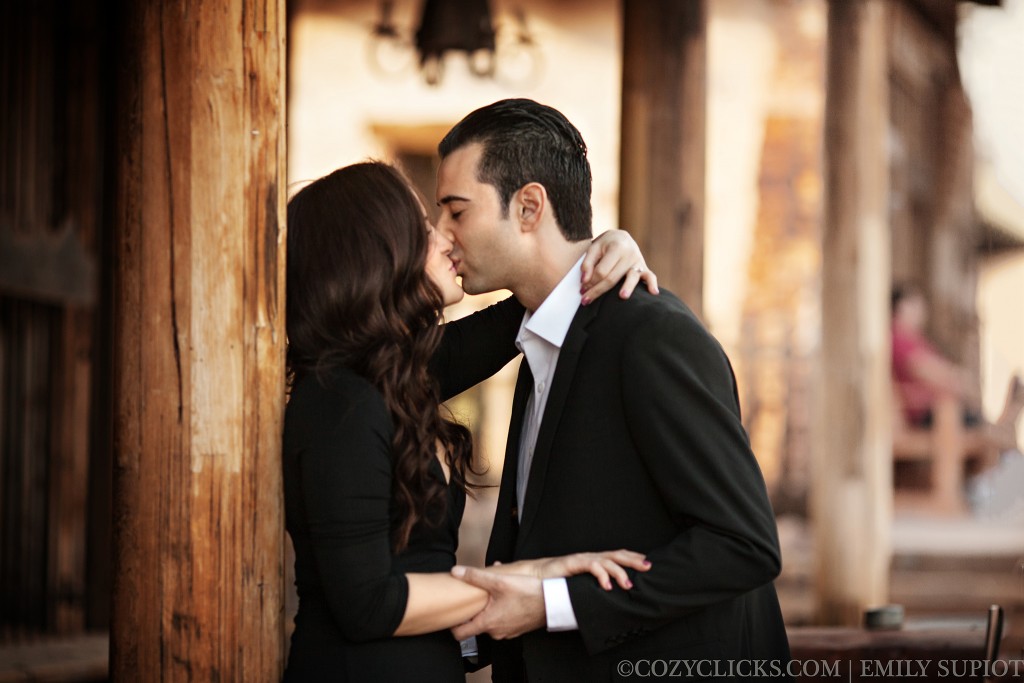 Couples kiss in engagement photo at Goldfield Ghost town
