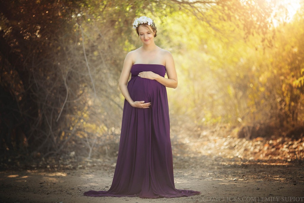 Full length maternity picture with gown in trees in Phoenix, Arizona