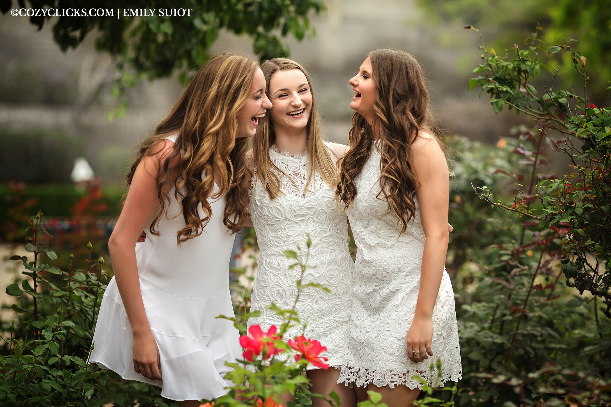Three high school senior girls laugh together at Heritage Square Garden in downtown Phoneix
