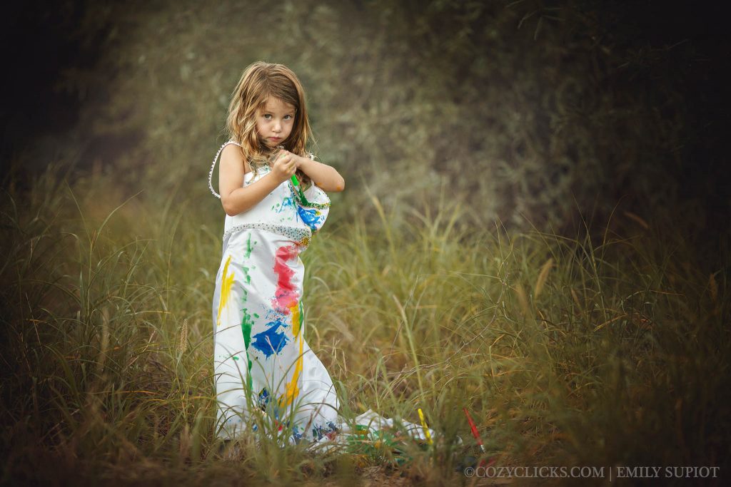 Young daughter gets to wear moms gown and then paints it in many colors in super cute photo session