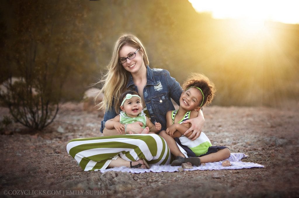 Mother and two daughters pose in this portrait taken in the desert in Phoenix, AZ