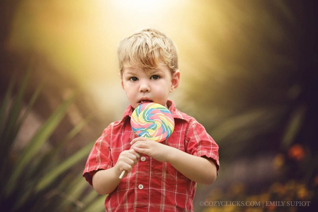 beautiful two year portrait photos in Phoenix of toddler with a lollipop