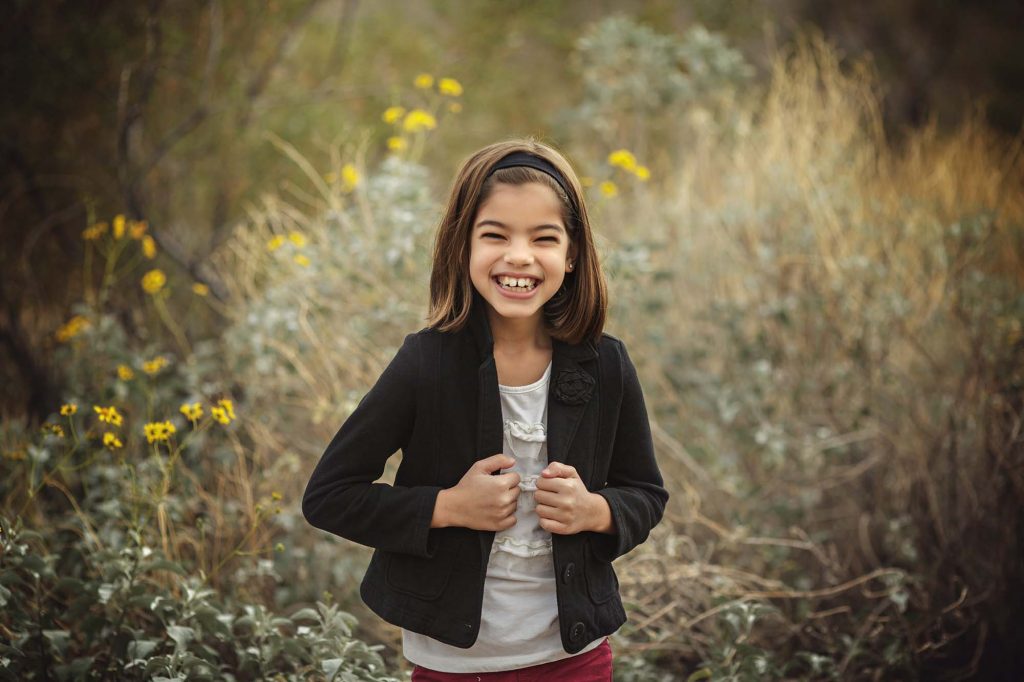 Beast Phoenix child photographer captures girl near wildflowers in the Phoenix desert