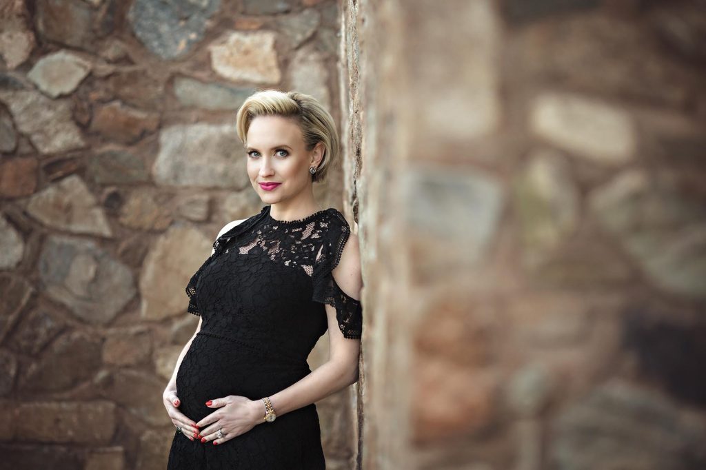 Maternity photography of mom to be at Scorpion Gulch by brick building
