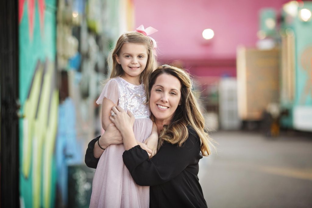 Mother and daughter portrait taken in Downtown Phoenix with colorful background