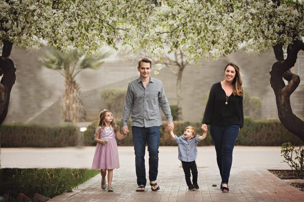 Family of four at Heritage Sqyuare Park in the spring time in downtown Phoenix
