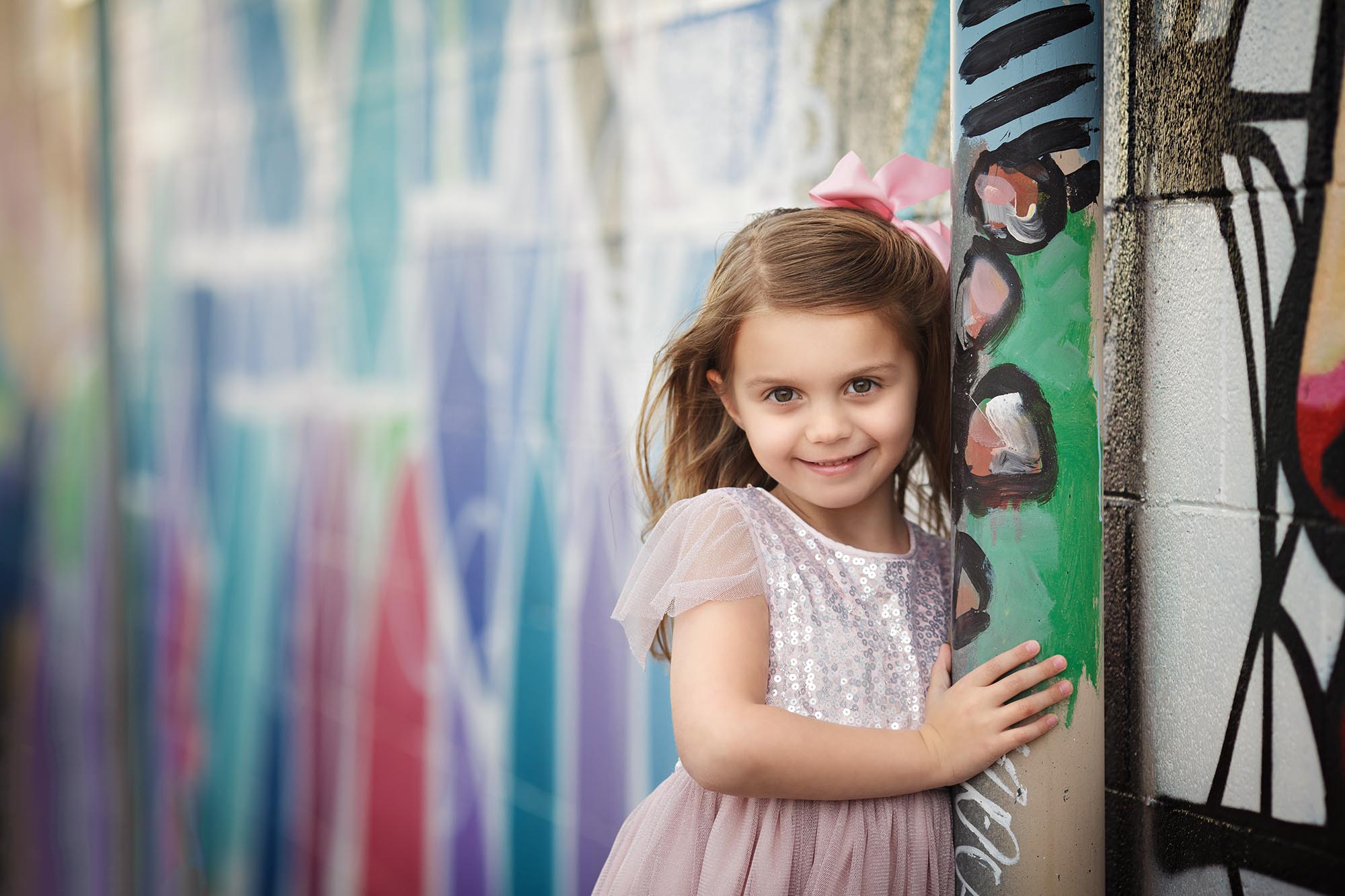Four year old girl portait near mural walls in Downtown Phoenix