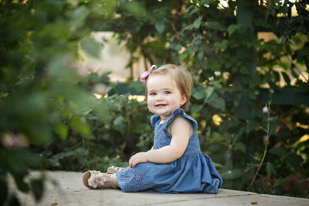 Super cute smiling one year old in Phoenix for outdoor portraits