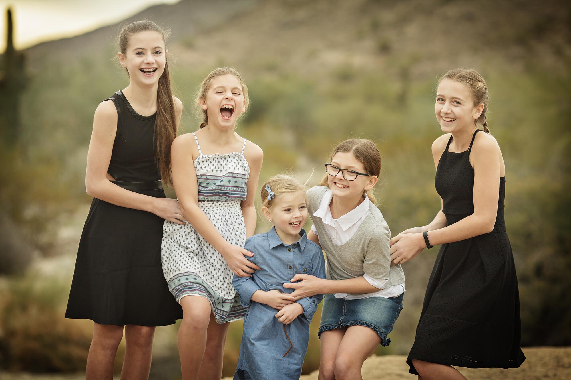 Fun cnadid moment in family photography shoot in Phoenix with many kids