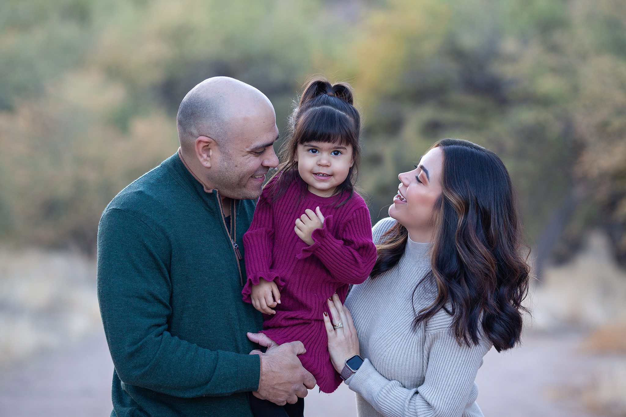 ozy and intimate family portrait with soft, warm lighting highlighting the connection between parents, children, and grandparents