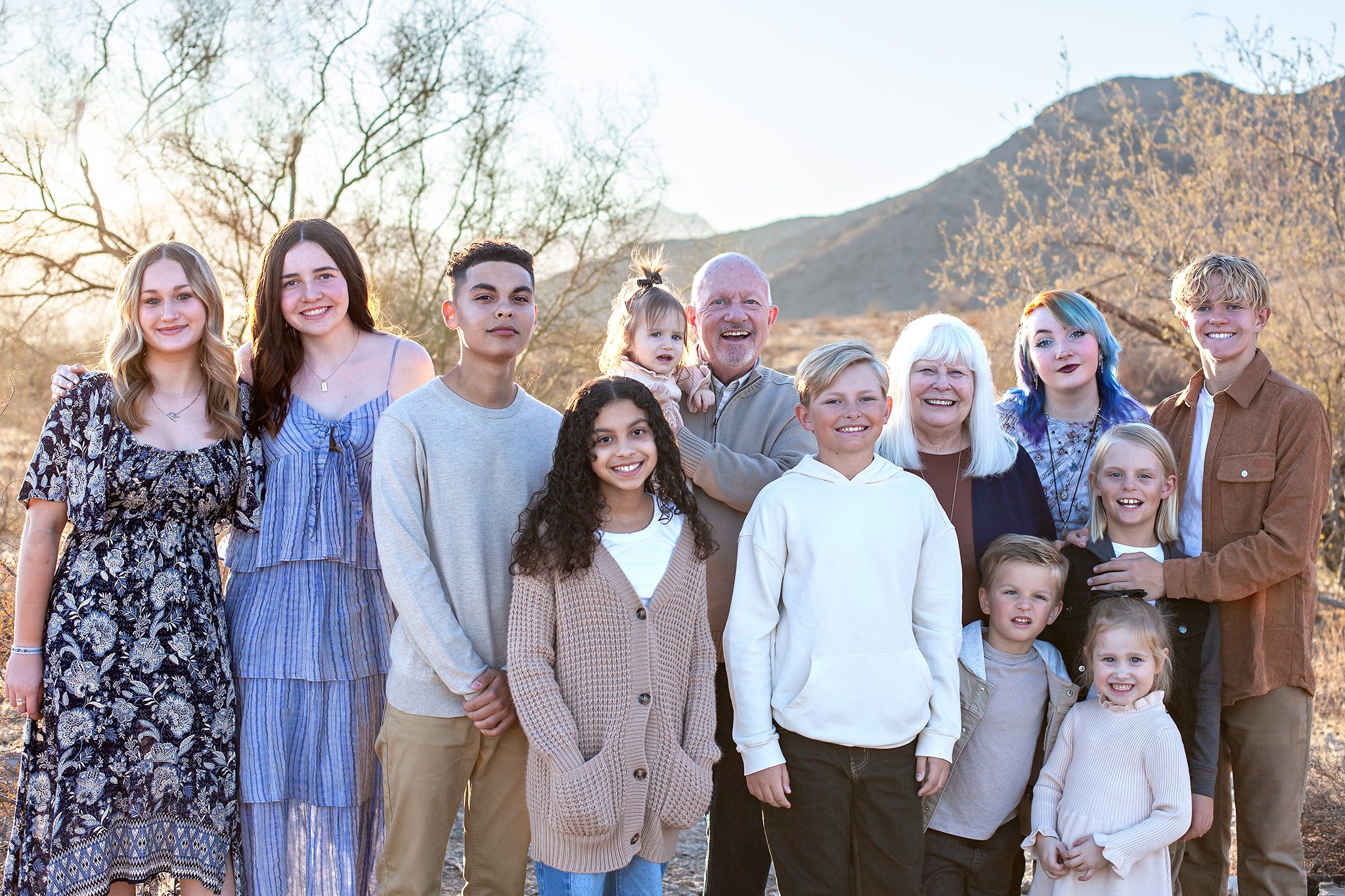 Candid moment of grandparents with grandchildren during an extended family photoshoot in Ahwatukee, Phoenix