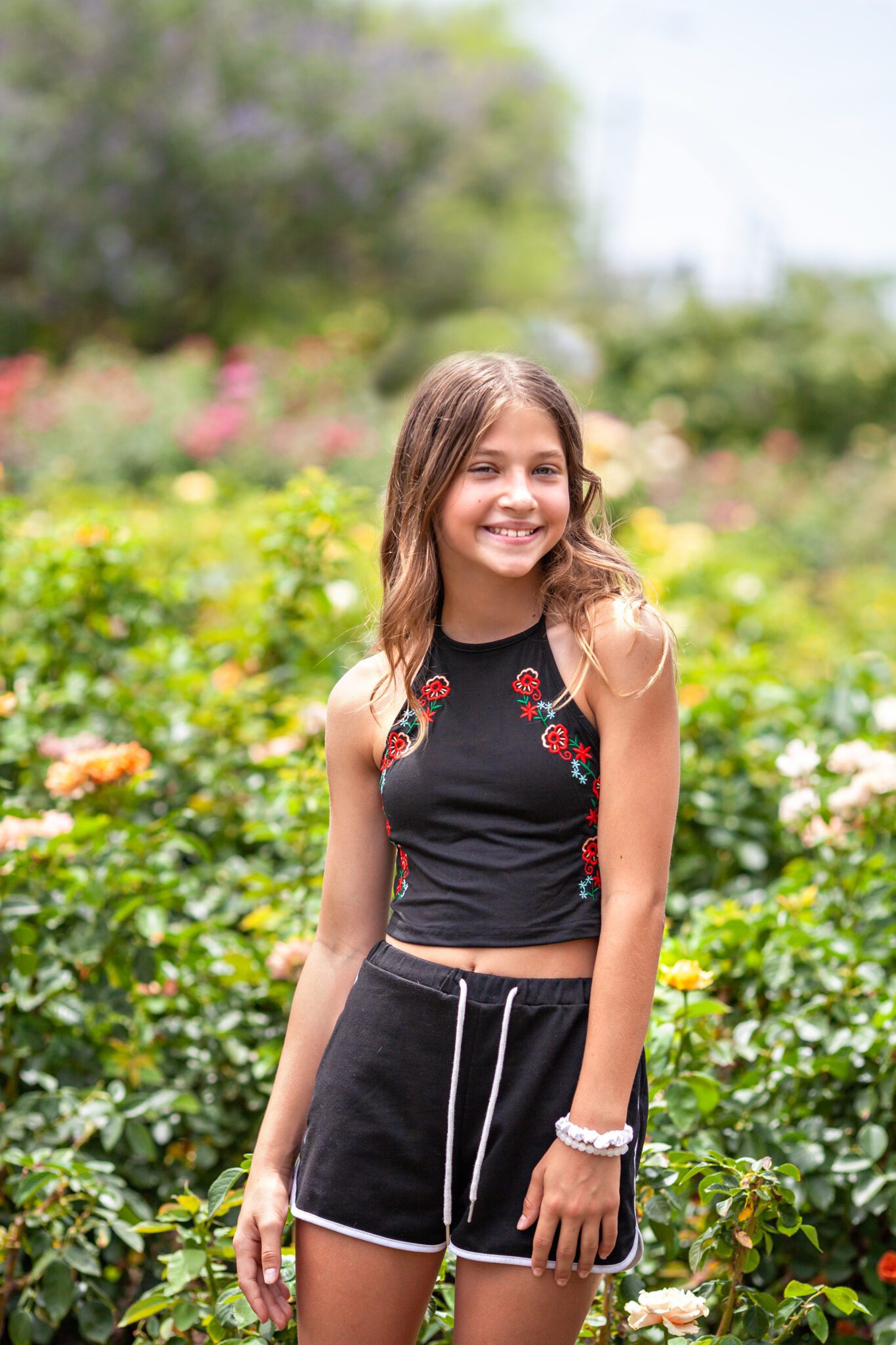 Children's photography in Phoenix near Mesa with greenery and roses